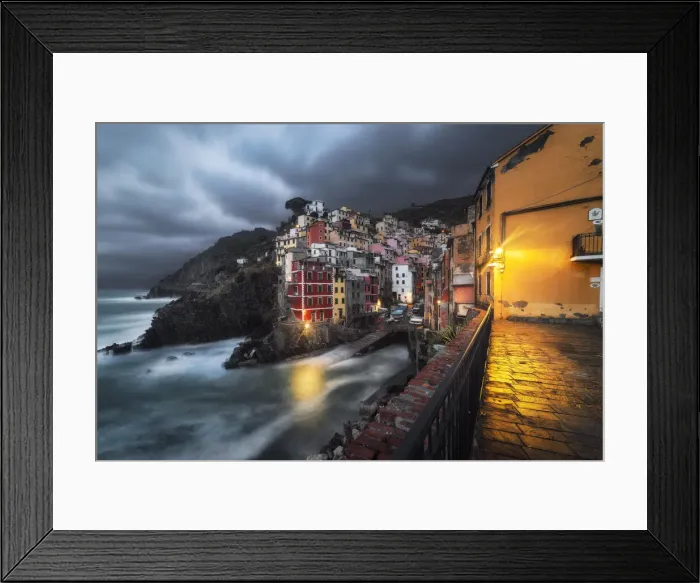 Framed Print : Cloudy evening over the village of Riomaggiore, National Park of Cinque Terre Framed Print : Cloudy evening over the village of Riomaggiore, National Park of Cinque Terre