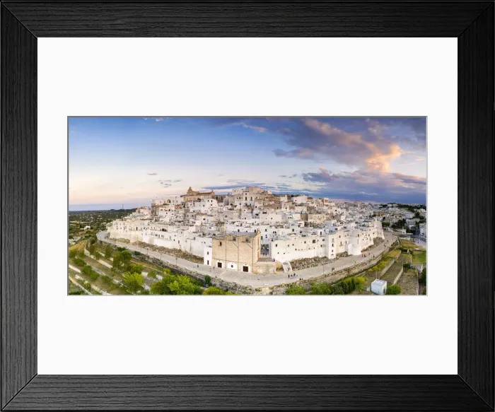 Framed Print : Traditional white buildings of Ostuni at sunset, aerial view, province of Brindisi