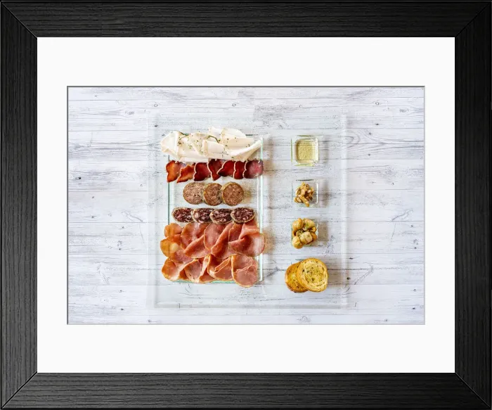 Framed Print : Overhead view of mixed cold cuts in glass serving plate with croutons as appetizer Framed Print : Overhead view of mixed cold cuts in glass serving plate with croutons as appetizer