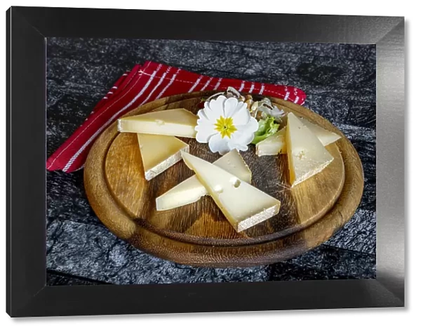 Selection of typical italian cheese in wood chopping board
