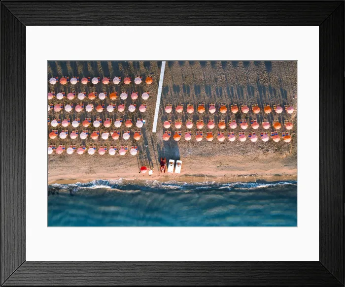 Framed Print : Aerial view of beach umbrellas in a row on sand beach washed by waves, Vieste Framed Print : Aerial view of beach umbrellas in a row on sand beach washed by waves, Vieste