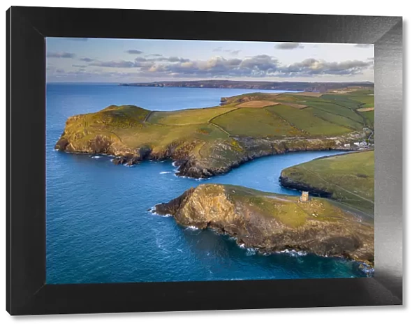 Aerial vista of Doyden Castle on the headland at Port Quin, Cornwall, England