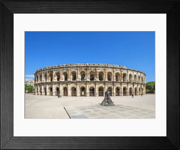 Framed Print : Arenas of Nimes, Roman amphitheater with bullfighter statue, Nimes, Gard