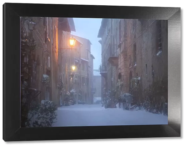 A street of Pienza during a winter snowstorm, Val d Orcia, Tuscany, Italy