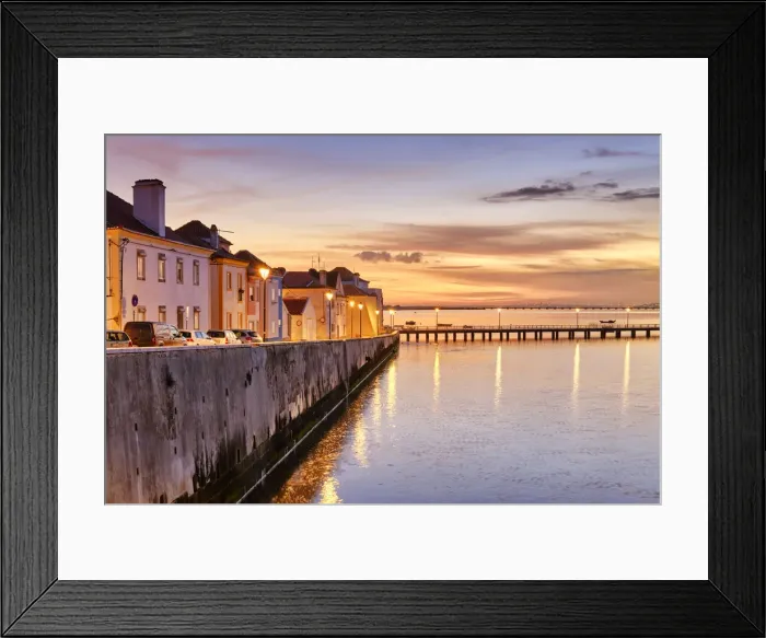 Framed Print : The traditional fishing village of Alcochete at sunset, spreading along the river Tagus Framed Print : The traditional fishing village of Alcochete at sunset, spreading along the river Tagus