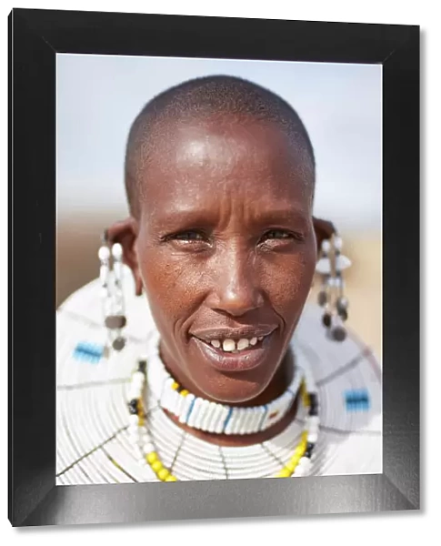 Portrait of a Msai woman wearing traditional beaded jewelry in a village near Arusha