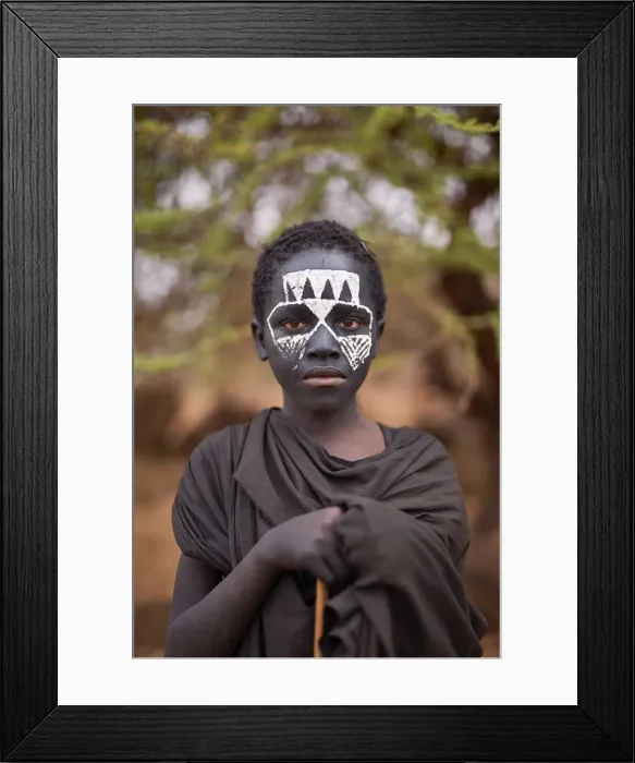 Framed Print : A young Msai warrior holding a stick in the Ngorongoro Protected Area, Tanzania Framed Print : A young Msai warrior holding a stick in the Ngorongoro Protected Area, Tanzania