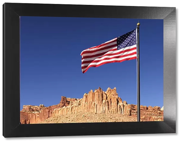 American flag and Waterpocket Fold rock formation, Capitol Reef National Park, Utah, USA