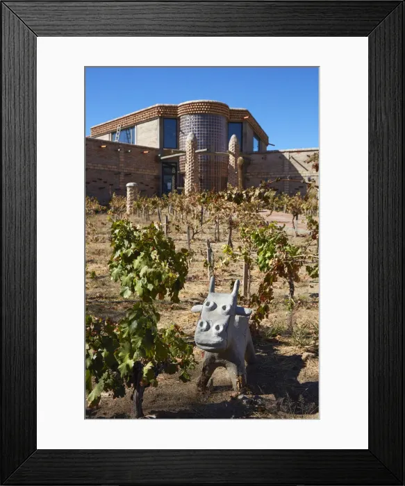 Framed Print : The main facade of the Bodega Las Arcas de Tolombon winery, Colalao del Valle, Calchaqui Valleys, Tucuman, Argentina. The winery architecture is inspired by the African city of Timbuktu (Mali) Framed Print : The main facade of the Bodega Las Arcas de Tolombon winery, Colalao del Valle, Calchaqui Valleys, Tucuman, Argentina. The winery architecture is inspired by the African city of Timbuktu (Mali)
