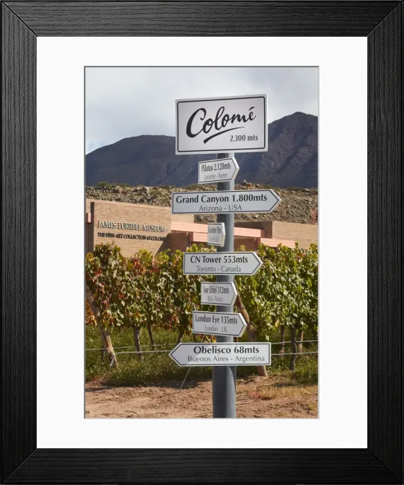 Framed Print : Signs indicating elevation differences in meters inside the Bodega Colomewinery Framed Print : Signs indicating elevation differences in meters inside the Bodega Colomewinery