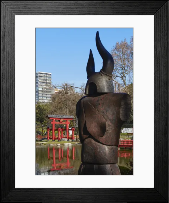 Framed Print : The statue of a Samurai in the foreground with the Buenos Aires Japanese Garden Framed Print : The statue of a Samurai in the foreground with the Buenos Aires Japanese Garden