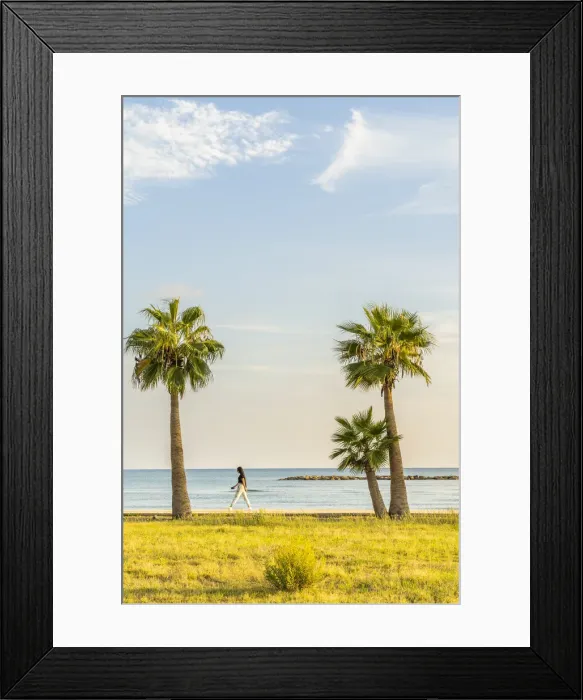 Framed Print : A girl walking along Palm Beach in Larnaca, Cyprus Framed Print : A girl walking along Palm Beach in Larnaca, Cyprus