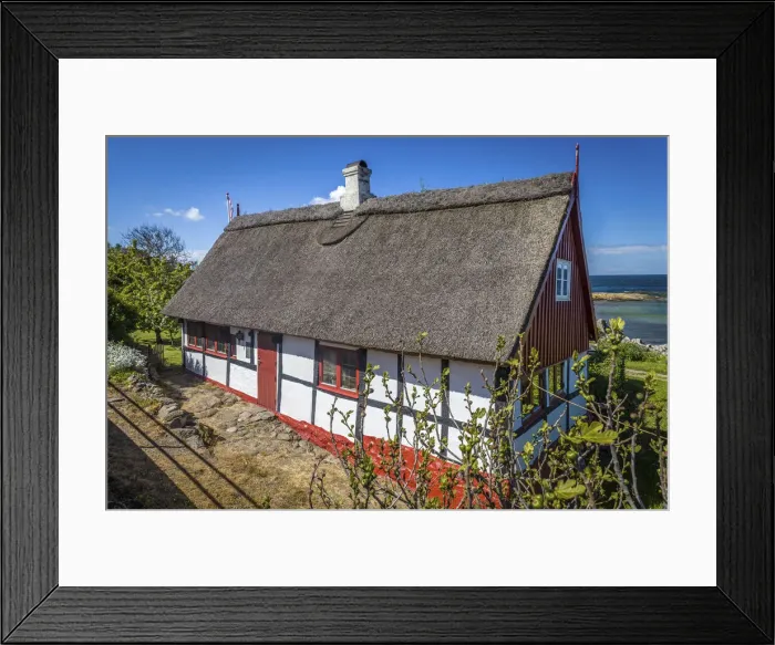 Framed Print : Idyllic half-timbered house in Svaneke on Bornholm, Denmark Framed Print : Idyllic half-timbered house in Svaneke on Bornholm, Denmark