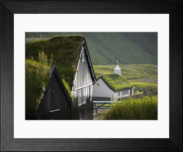 Framed Print : The old Duvugarðar farm and the church of Saksun. Stryemoy, Faroe Islands