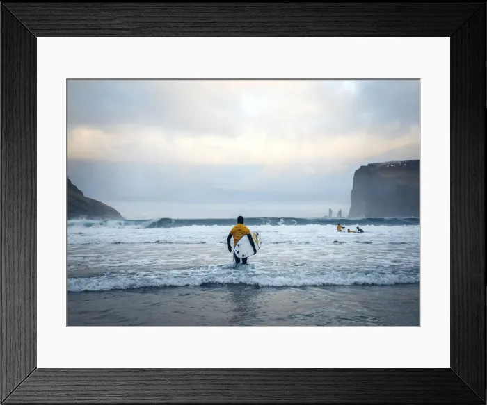 Framed Print : A surfer on the sandy beach of Tjornuvik walking towards the ocean. Streymoy, Faroe Islands Framed Print : A surfer on the sandy beach of Tjornuvik walking towards the ocean. Streymoy, Faroe Islands
