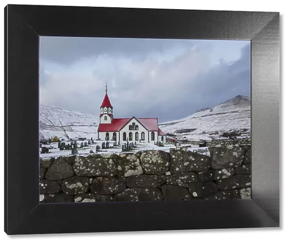 The church in Sandavagur covered by snow. Vagar, Faroe Islands