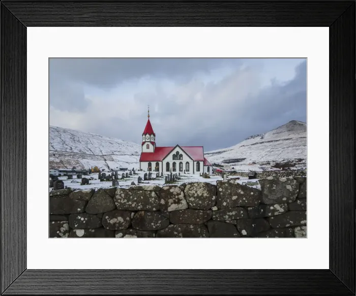 Framed Print : The church in Sandavagur covered by snow. Vagar, Faroe Islands