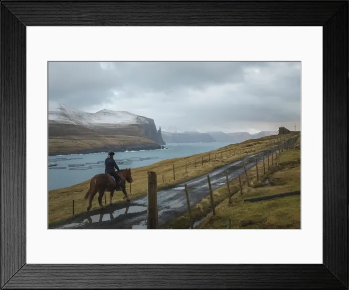 Framed Print : Horse and rider riding along the fjords, Miðvagur, Vagar, Faroe Islands Framed Print : Horse and rider riding along the fjords, Miðvagur, Vagar, Faroe Islands