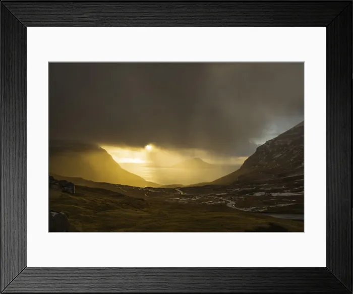 Framed Print : Rain illuminated by sun above the village of Norðradalur. In the background the island of Koltur. Streymoy, Faroe Islands Framed Print : Rain illuminated by sun above the village of Norðradalur. In the background the island of Koltur. Streymoy, Faroe Islands