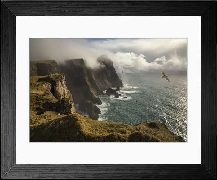Framed Print : The impressive coast on the west side of Suðuroy seen from Eggjarnar. In the background the Beinisvorð cliff. Suðuroy, Faroe Islands Framed Print : The impressive coast on the west side of Suðuroy seen from Eggjarnar. In the background the Beinisvorð cliff. Suðuroy, Faroe Islands