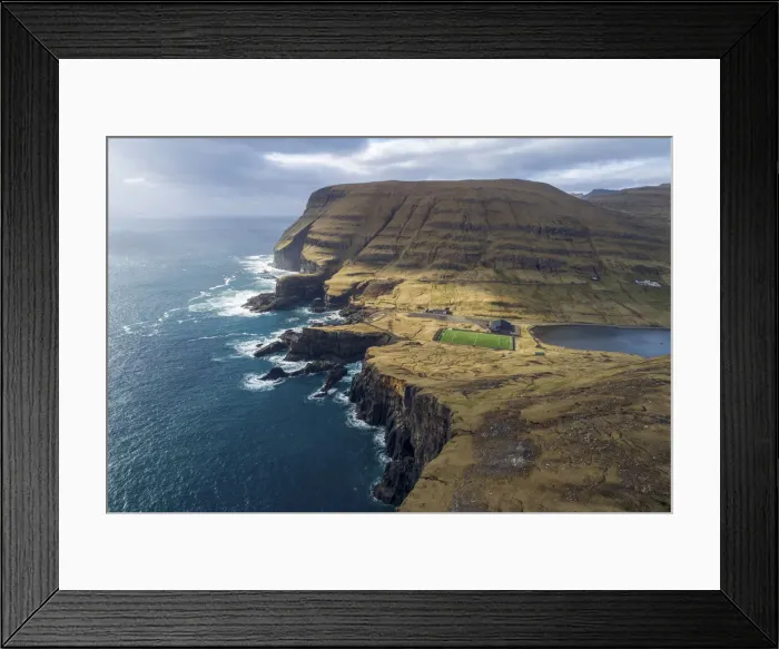 Framed Print : Football field in Vagur close to the cliffs on the west coast of Suðuroy. Faroe Islands Framed Print : Football field in Vagur close to the cliffs on the west coast of Suðuroy. Faroe Islands