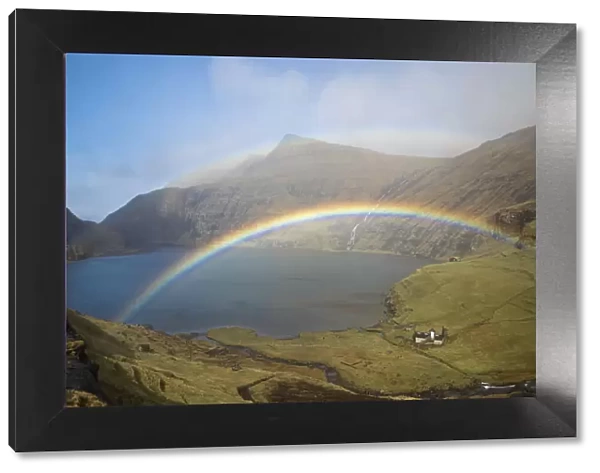 A double rainbow over the lagoon of Saksun. Streymoy, Faroe Islands