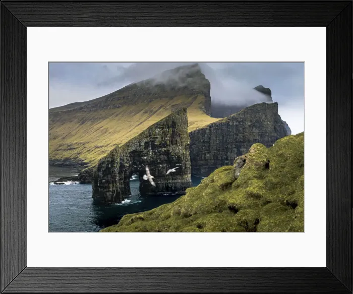 Framed Print : Drangarnir and the island of Vagar seen from Tindholmur. Faroe Islands Framed Print : Drangarnir and the island of Vagar seen from Tindholmur. Faroe Islands