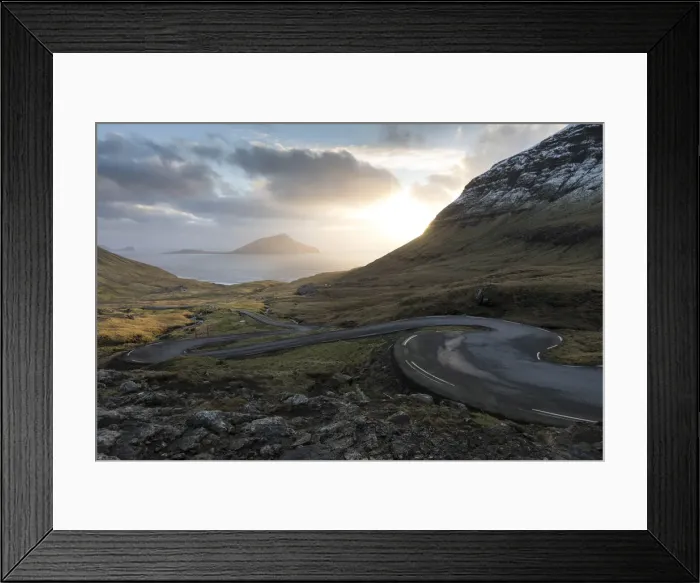Framed Print : The scenic road for Norðradalur at sunset. The island of Koltur in the background. Faroe Islands