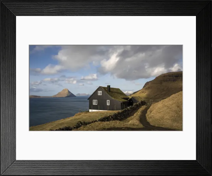 Framed Print : A traditional Faroese house in Velbastaður. The island of Koltur in the background. Faroe Islands Framed Print : A traditional Faroese house in Velbastaður. The island of Koltur in the background. Faroe Islands