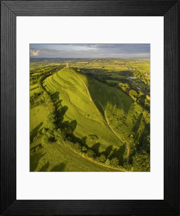 Framed Print : Aerial view of Glastonbury Tor and St Michaels Tower, Somerset, England Framed Print : Aerial view of Glastonbury Tor and St Michaels Tower, Somerset, England