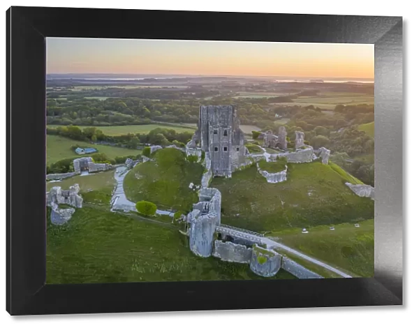 Aerial view of the abandoned ruins of Corfe Castle at dawn, Dorset, England