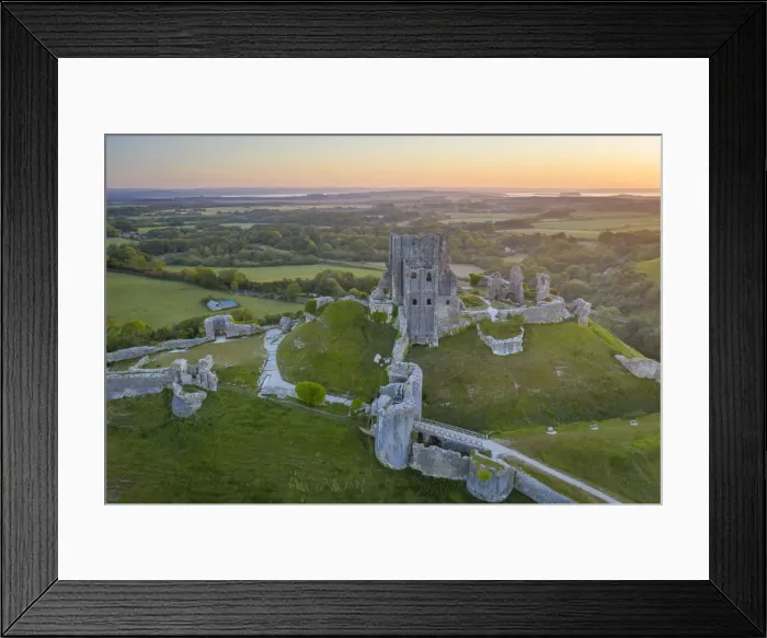Framed Print : Aerial view of the abandoned ruins of Corfe Castle at dawn, Dorset, England Framed Print : Aerial view of the abandoned ruins of Corfe Castle at dawn, Dorset, England