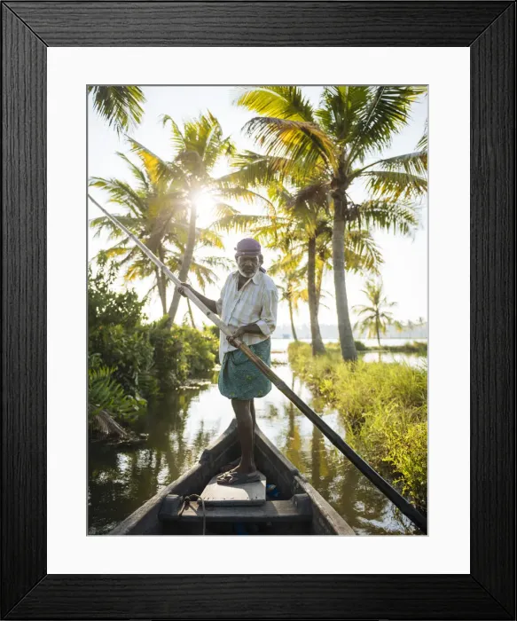 Framed Print : Anthony the boatman guiding the vessel through Keralan backwaters near North Paravoor Framed Print : Anthony the boatman guiding the vessel through Keralan backwaters near North Paravoor