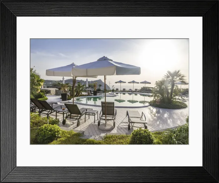 Framed Print : Swimming pool with umbrellas and loungers in Forio, Ischia Island, Gulf of Naples Framed Print : Swimming pool with umbrellas and loungers in Forio, Ischia Island, Gulf of Naples