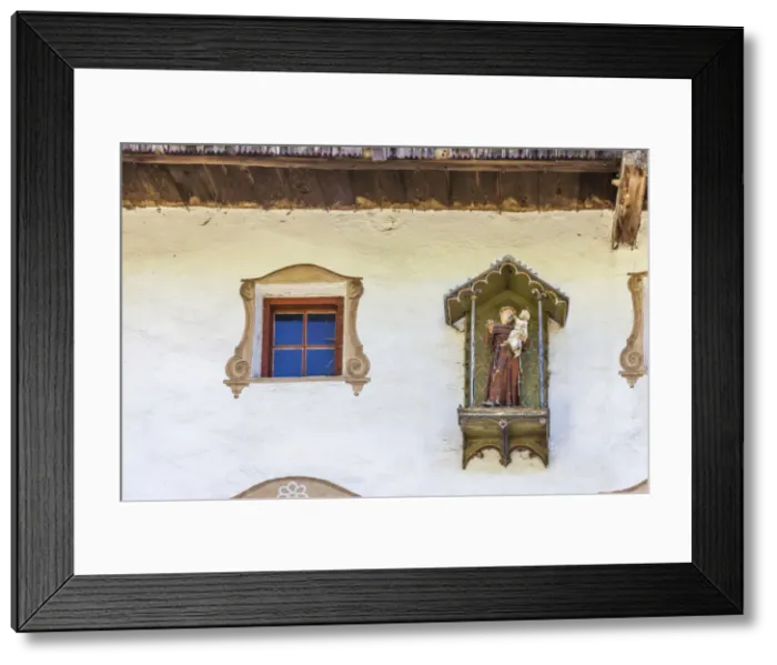 Framed Print : statue of St. Anthony on an old farmhouse in St. Magdalena in Villnoss Valley, South Tyrol, Italy Framed Print : statue of St. Anthony on an old farmhouse in St. Magdalena in Villnoss Valley, South Tyrol, Italy