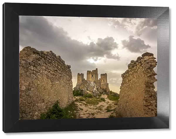 europe, Italy, the Abruzzi. Rocca Calascio at sunset with dramatic clouds building up