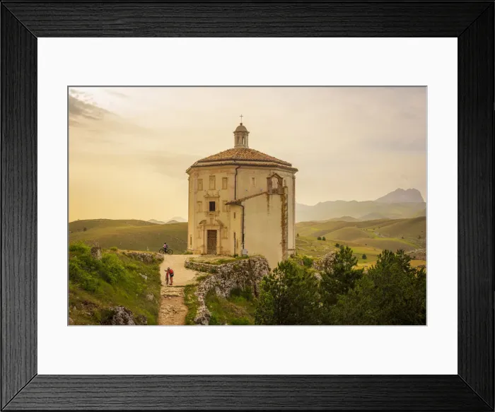 Framed Print : europe, Italy, the Abruzzi. On mountain bike in front of the church Santa Maria della Framed Print : europe, Italy, the Abruzzi. On mountain bike in front of the church Santa Maria della