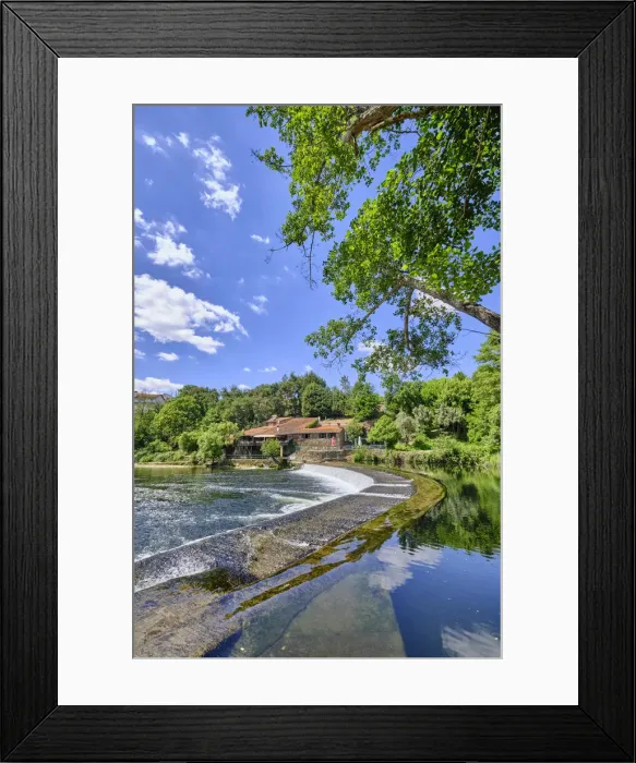 Framed Print : The Alva river at Coja with a restaurant on a old building on the riverside