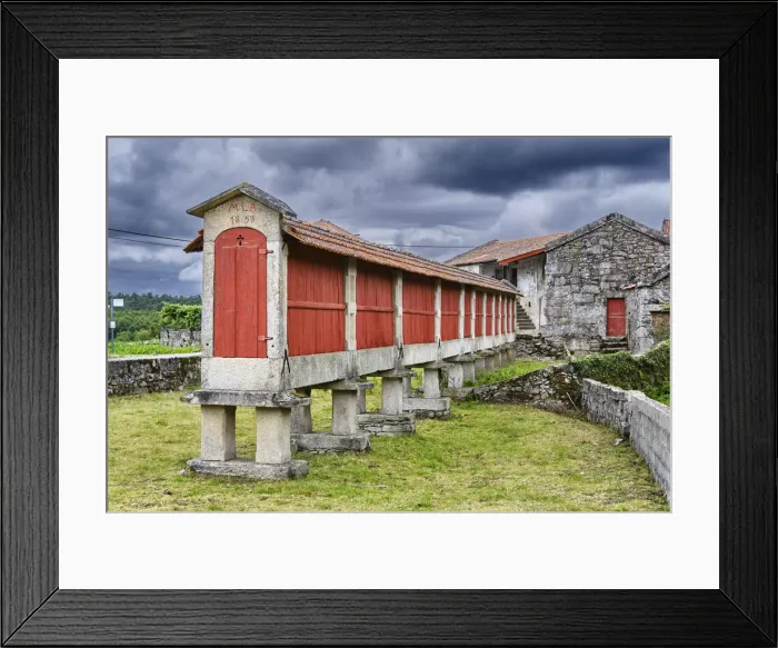 Framed Print : The longest granary (espigueiro) in Portugal with 29, 40m, dating back to 1853 Framed Print : The longest granary (espigueiro) in Portugal with 29, 40m, dating back to 1853