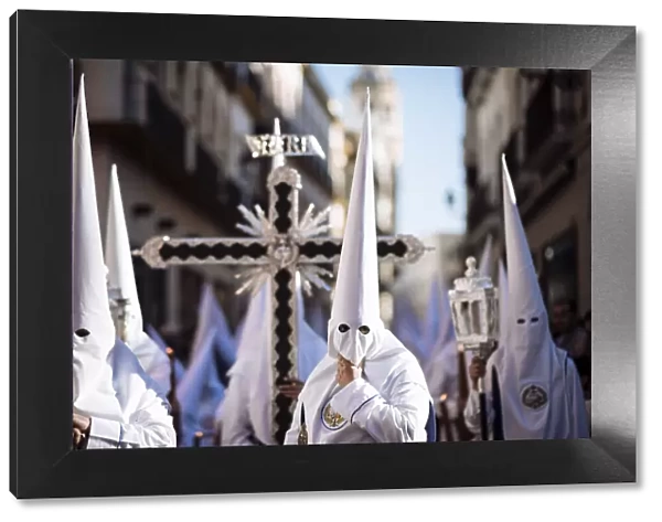 Penitents of Los Negritos Brotherhood taking part in processions during