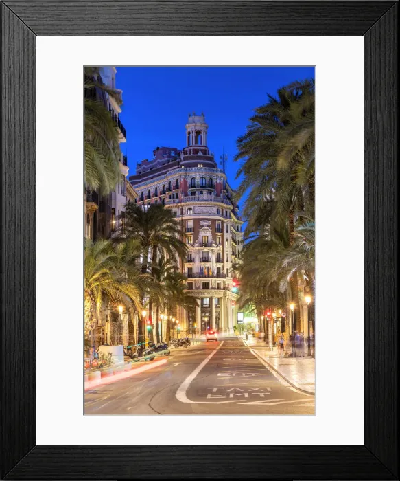 Framed Print : Twilight view of a street in the city center with the historical Banco de Valencia Framed Print : Twilight view of a street in the city center with the historical Banco de Valencia