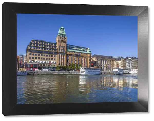 Stockholm harbor with historic hotel and ferries, Sweden