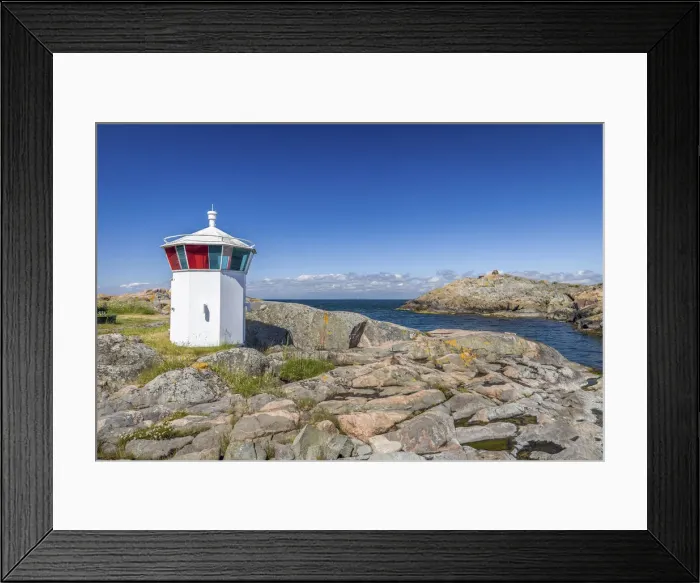 Framed Print : Small lighthouse in the harbor of Landsort on the archipelago island of Oja Framed Print : Small lighthouse in the harbor of Landsort on the archipelago island of Oja