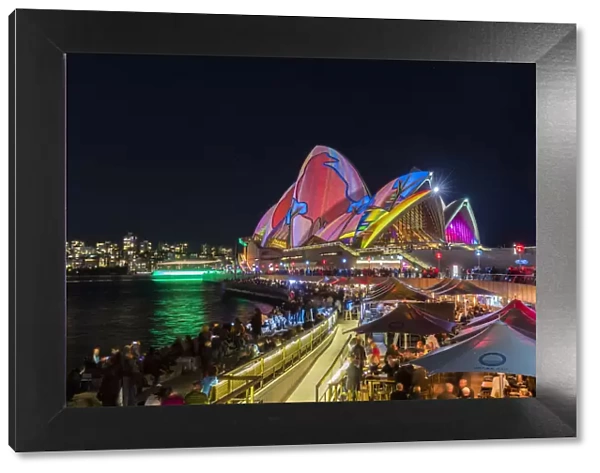 Opera Bar and Sydney Opera House illuminated with projections during Vivid Sydney