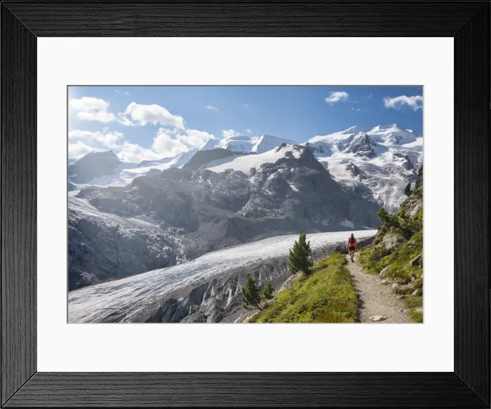 Framed Print : Woman walks along the track above the Morteratsch glacier, Morteratsch, Engadine Framed Print : Woman walks along the track above the Morteratsch glacier, Morteratsch, Engadine