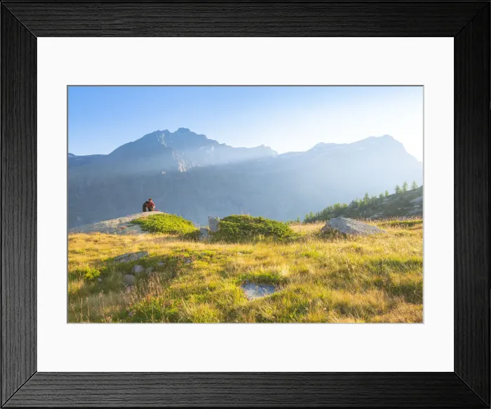 Framed Print : An hiker admires the sunset near Refuge Jervis, Valle dell Orco Framed Print : An hiker admires the sunset near Refuge Jervis, Valle dell Orco