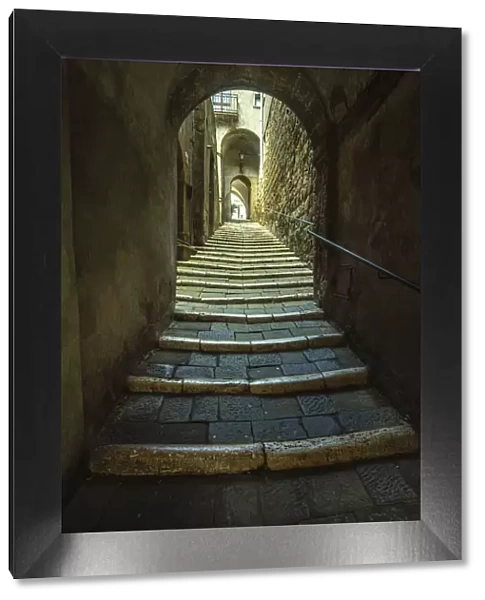 Stone steps in a narrow alley between medieval houses, access to the Jewish ghetto of