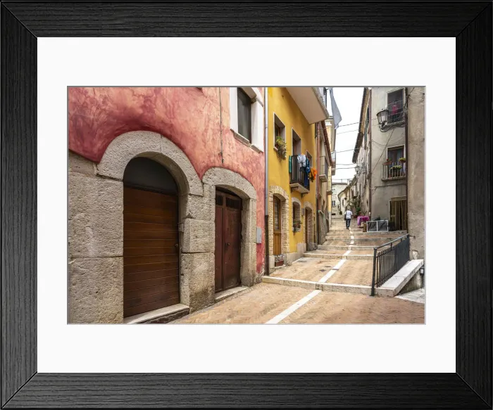 Framed Print : Alleys in the historic center of Campobasso with colored facades and brick paving