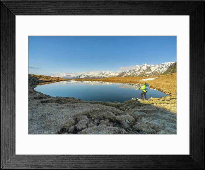 Framed Print : Man at Andossi Lake over Splugenpass at sunrise, Sondrio, Grigioni, Lombardy, Italy (MR) Framed Print : Man at Andossi Lake over Splugenpass at sunrise, Sondrio, Grigioni, Lombardy, Italy (MR)