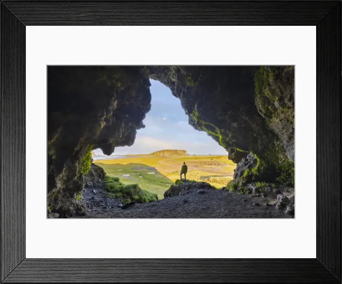Framed Print : A man observes Dyrholaey cliff from a cave during summer, Vik I Myrdal, southern Iceland Framed Print : A man observes Dyrholaey cliff from a cave during summer, Vik I Myrdal, southern Iceland